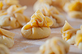 Dumplings on a floured work surface