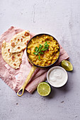 Indian red lentil curry soup dal with rice naan (vegan)