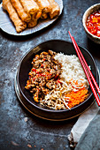 Sticky sesame beef with rice and vegetables