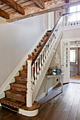 Runner with bold pattern on staircase in elegant country house