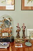 Kitsch, gilt, vintage-style arrangement with flamingo-shaped candlesticks