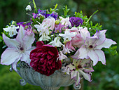 Early summer bouquet with peony, clematis 'Omoshiro', columbine and ornamental onion