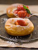 Auszogne (Bavarian-style doughnuts) with strawberries