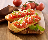 Bruschetta topped with tomatoes and onions