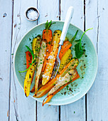 Colourful roasted carrots with salt flakes