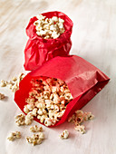 Popcorn in red paper bags