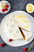 Raspberry and rhubarb cake with lemon cream, sliced