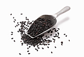 Black sesame seeds in a metal scoop