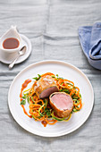 Pork fillet wrapped in pastry with vegetable spirals