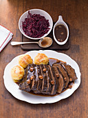Sauerbraten with dumplings and red cabbage