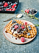 Waffles with cream and fresh berries