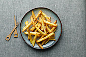 French fries with salt on a plate
