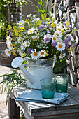 Early summer meadow bouquet with daisies, widow flowers, cumin and rapeseed blossoms