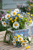 Meadow bouquets with daisies, forget-me-nots and buttercups, small grass wreath