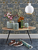 Vases with covers made from floral paper in front of vintage-style floral wallpaper