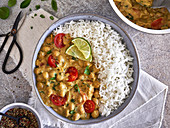Spicy chickpea curry with cherry tomatoes and rice