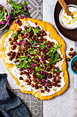 Flatbread with labneh, crisp smoked paprika chickpeas and mixed herbs