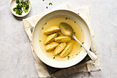 Semolina dumpling soup with chives