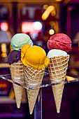 Various ice cream cones in a cafe