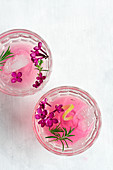 Pink cocktail with lilac and rosemary