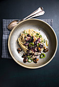 Spaghetti with fried radicchio, mushrooms and peppers