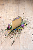A piece of hay milk cheese on a wooden surface