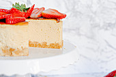 Amarula cream cheese cake with strawberries, sliced