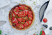 Puff pastry tart with strawberries and pistachios