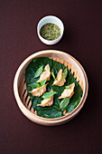 Shrimp dim sum steamed in pepper leaves with miso salsa