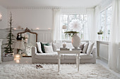 Christmas decorations in classic, white living room