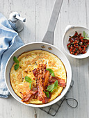 Danish omelette with tomatoes, mint and bacon
