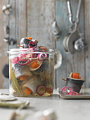 Homemade pickled herring with pumpkin and red onions