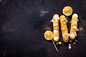Pina colada eclairs with pineapple and coconut