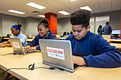 Teenagers learning to code