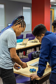 Teenagers setting up a drone