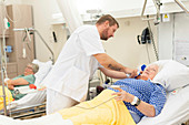 Nurse taking patient's temperature