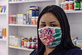Pharmacy worker wearing face mask