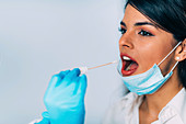 Medical worker taking swab for a coronavirus test