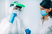 Medical worker taking swab for a coronavirus test