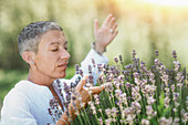 Woman with lavender plant