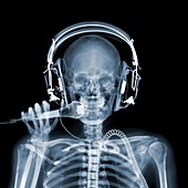 Skeleton with headphones holding microphone, X-ray