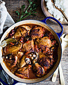 Chicken casserole in a casserole dish on a wooden table