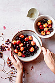 Red and white cherries in a bowl with stones removed.