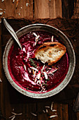 Piece of bread on beet soup