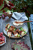 Obazda with grape, cheese and bacon skewers