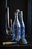 Vintage bottles and kitchen utensils