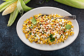 Mexican street corn, elote with cotija cheese, fresh cilantro and chili