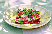 Beetroot with strawberries, grapefruit and arugula