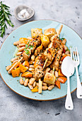 Chicken skewers with a white bean salad
