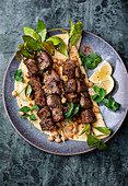 Lamb skewers with flatbread and chickpea salad
